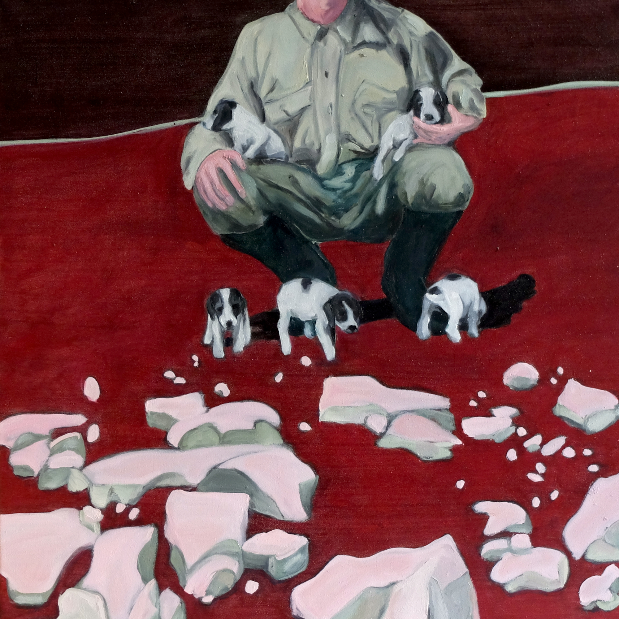 Ein deutscher Kolonist und Farmer in Afrika präsentiert hockend den Bildbetrachtern Hundewelpen